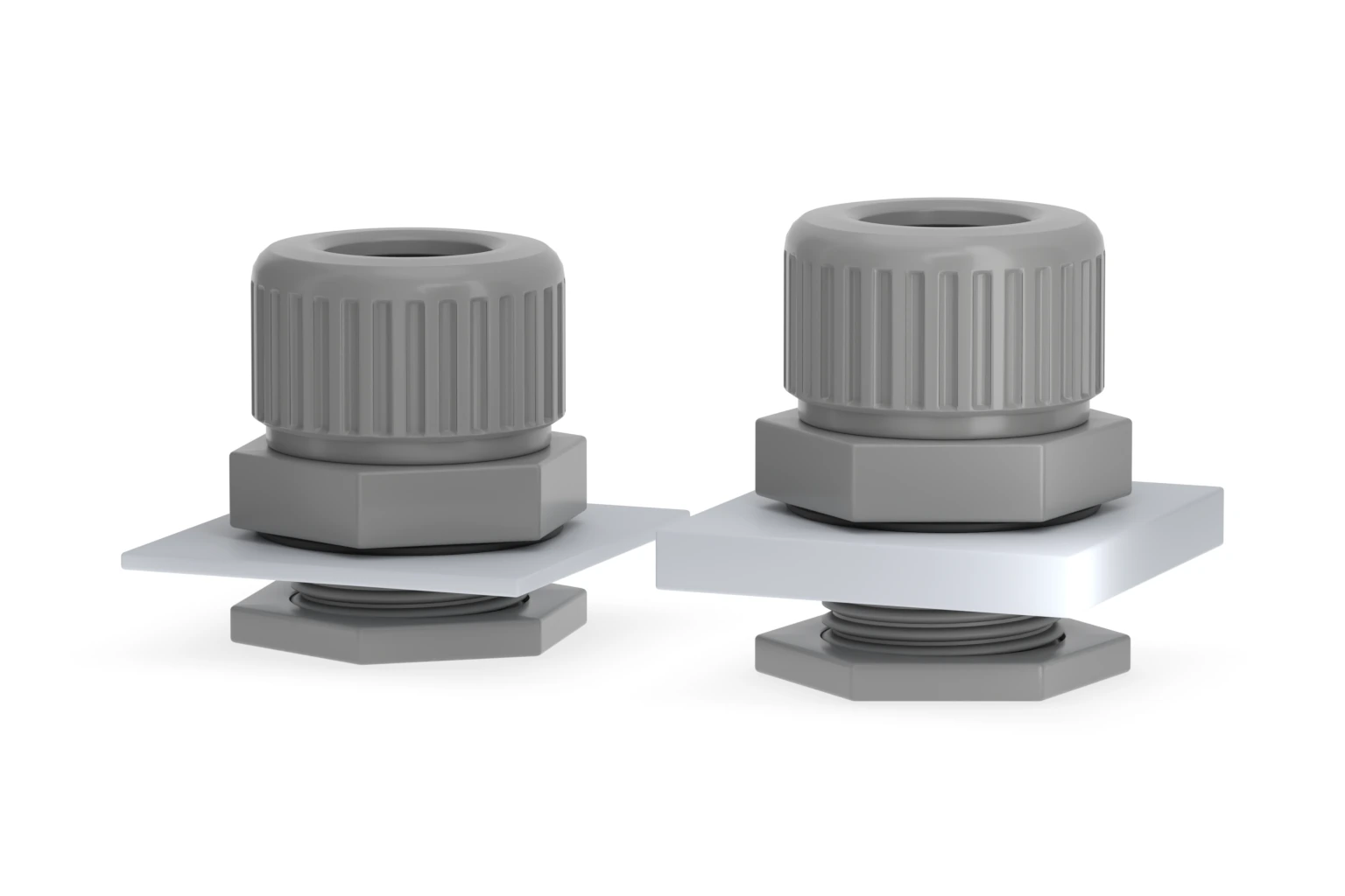Two grey M20 nylon cable glands installed through thin and thick panels