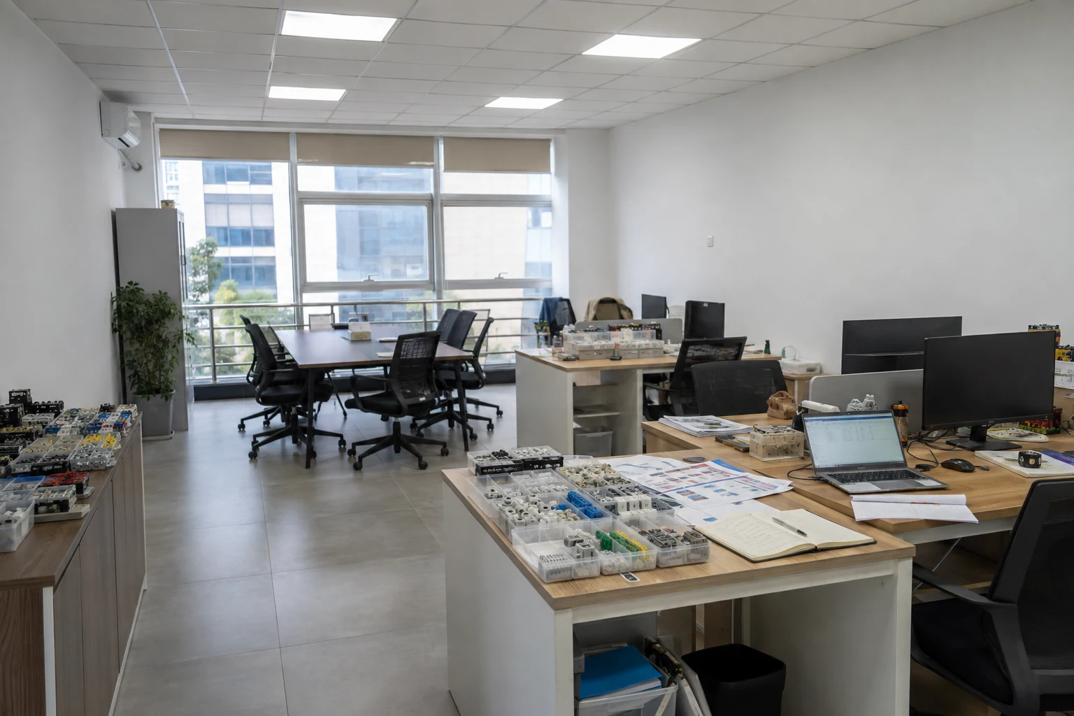 Office work area with product samples and technical documents