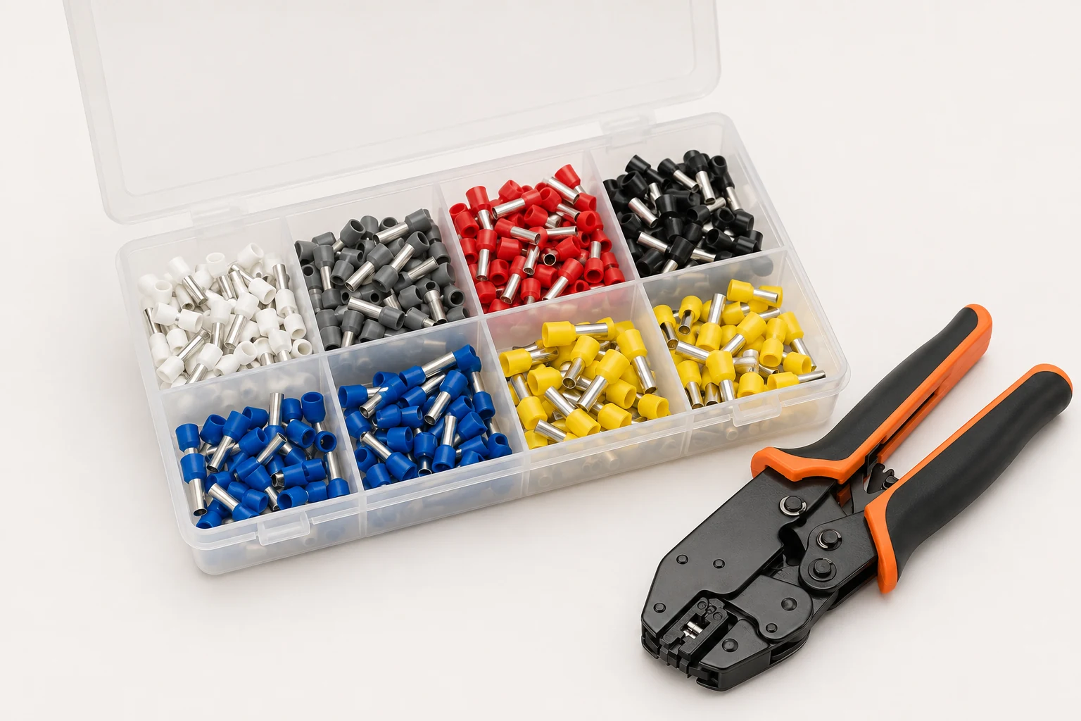 Insulated wire ferrule assortment box beside a ratchet crimping tool
